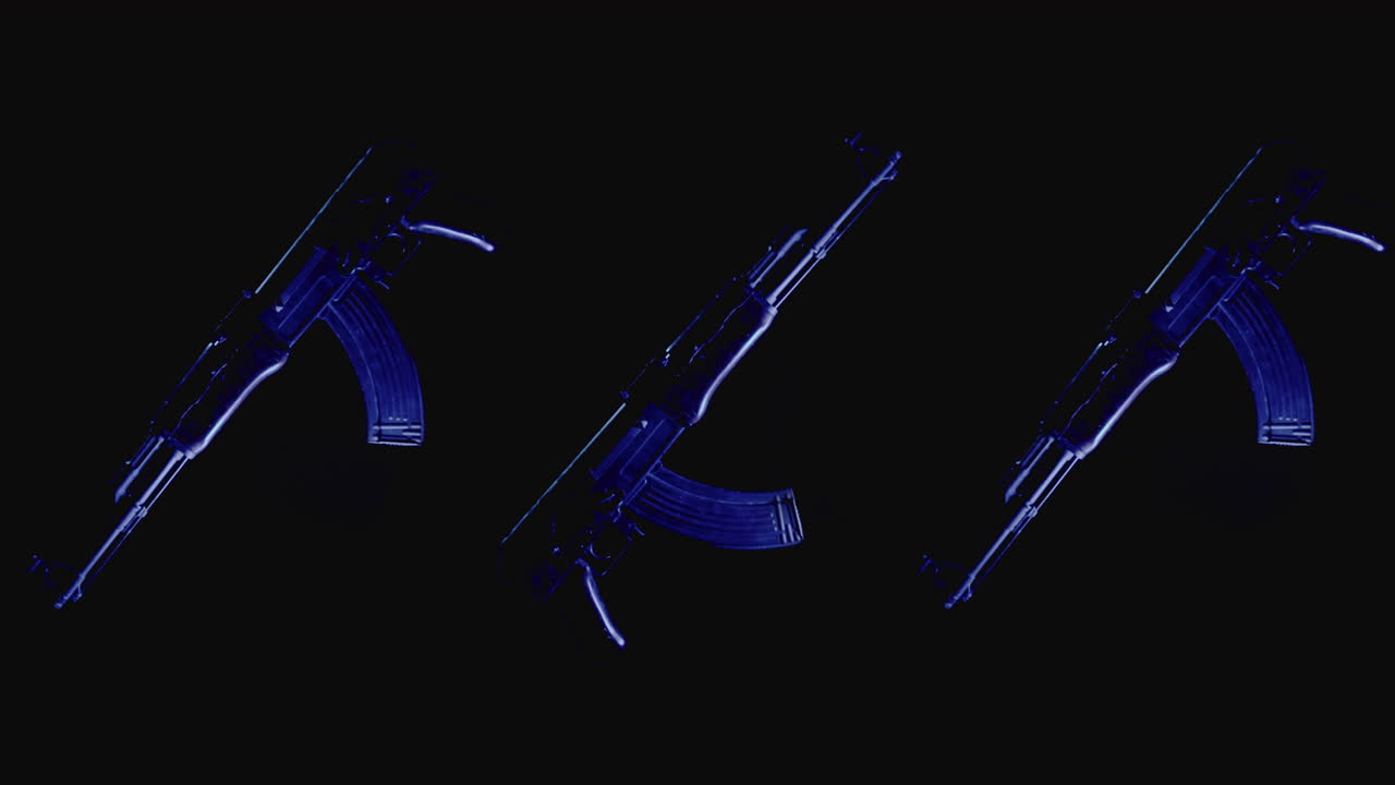 Machineguns on the dark background and in blinking red and blue light rotate in slowmotion
