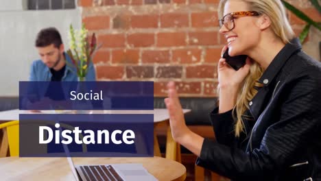 animation of a sign social distance over caucasian people working in a coffee shop