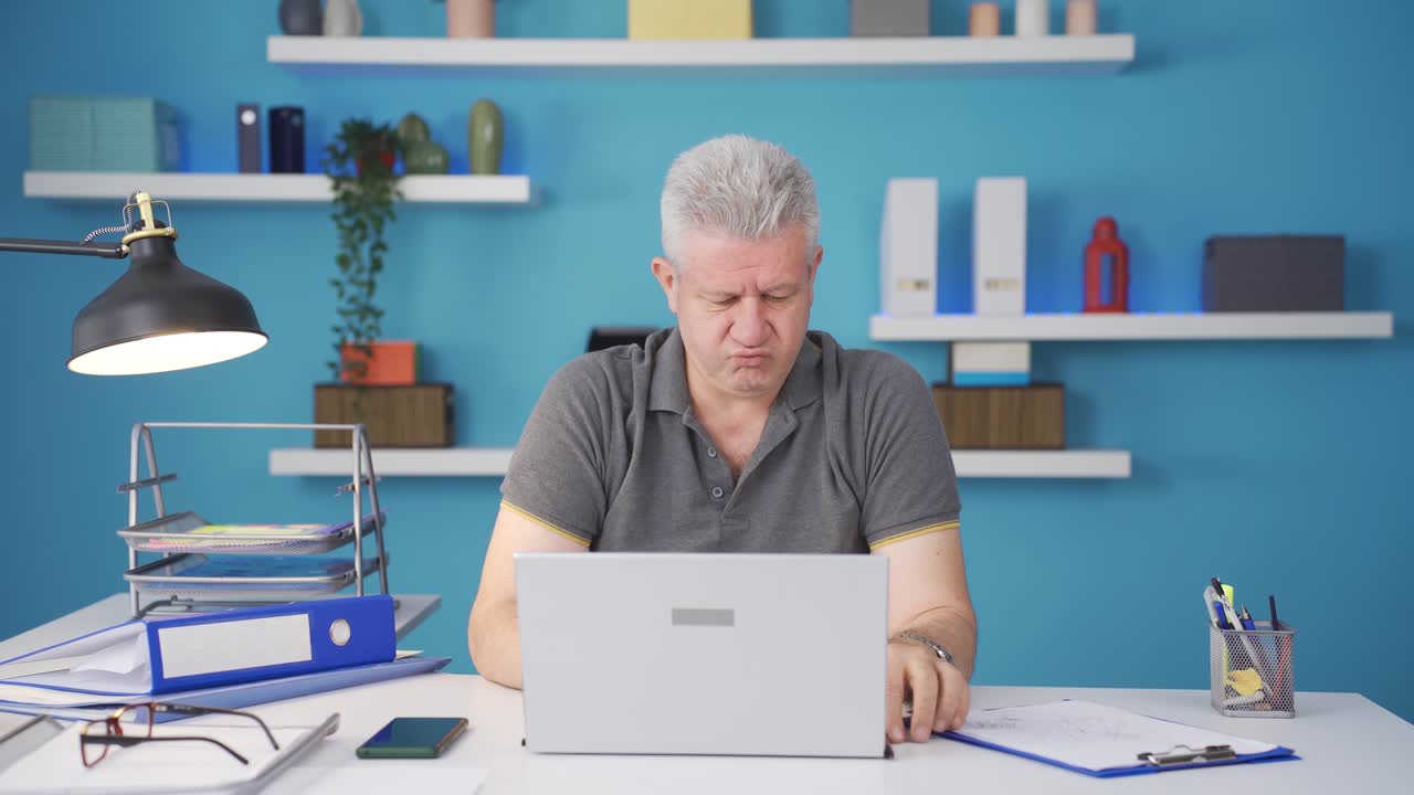 Home office worker man is aggressive and addicted to violence.