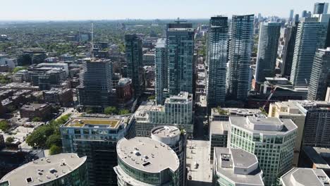 drone circling over sunny downtown area of toronto