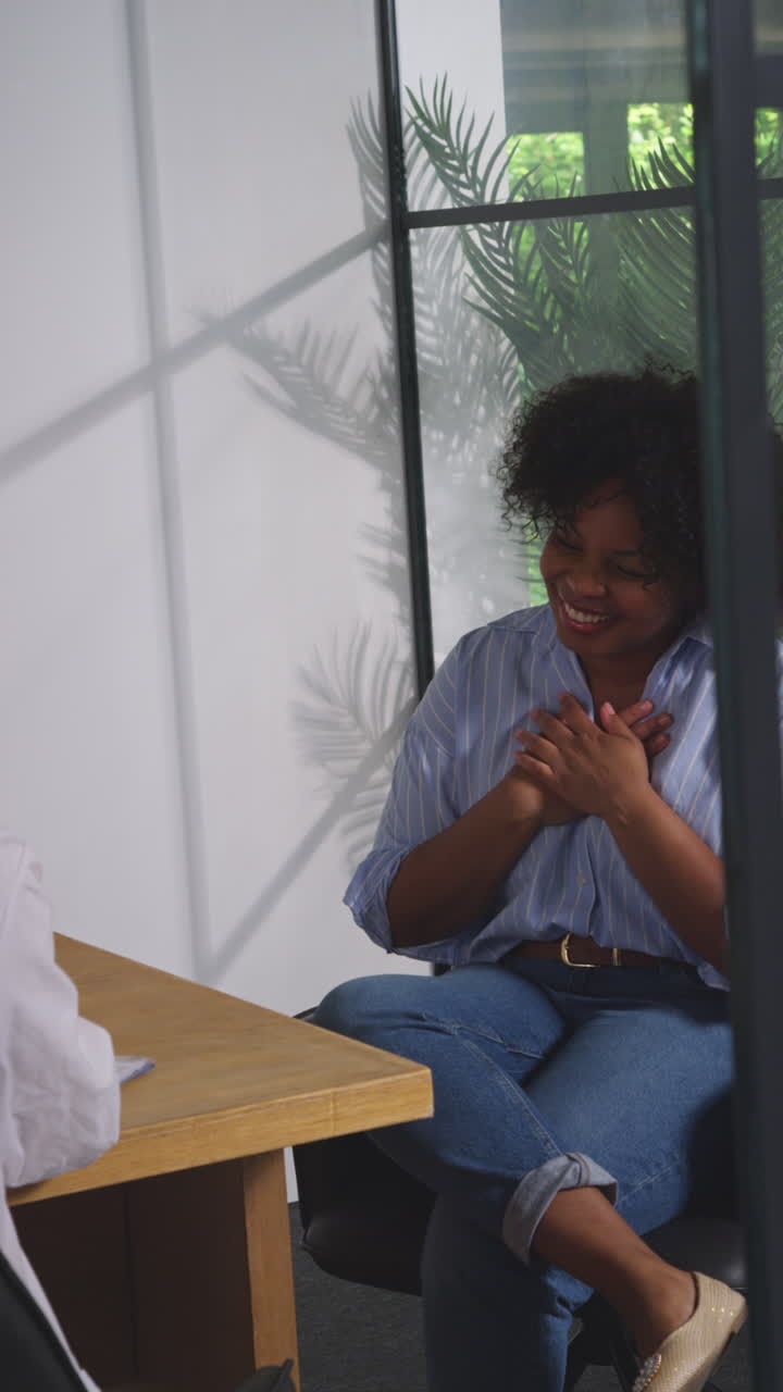 Vertical Video Of Relieved Woman Being Given All Clear Shaking Hands With Doctor Or Oncologist At Meeting In Treatment Clinic For Breast Cancer In Hospital