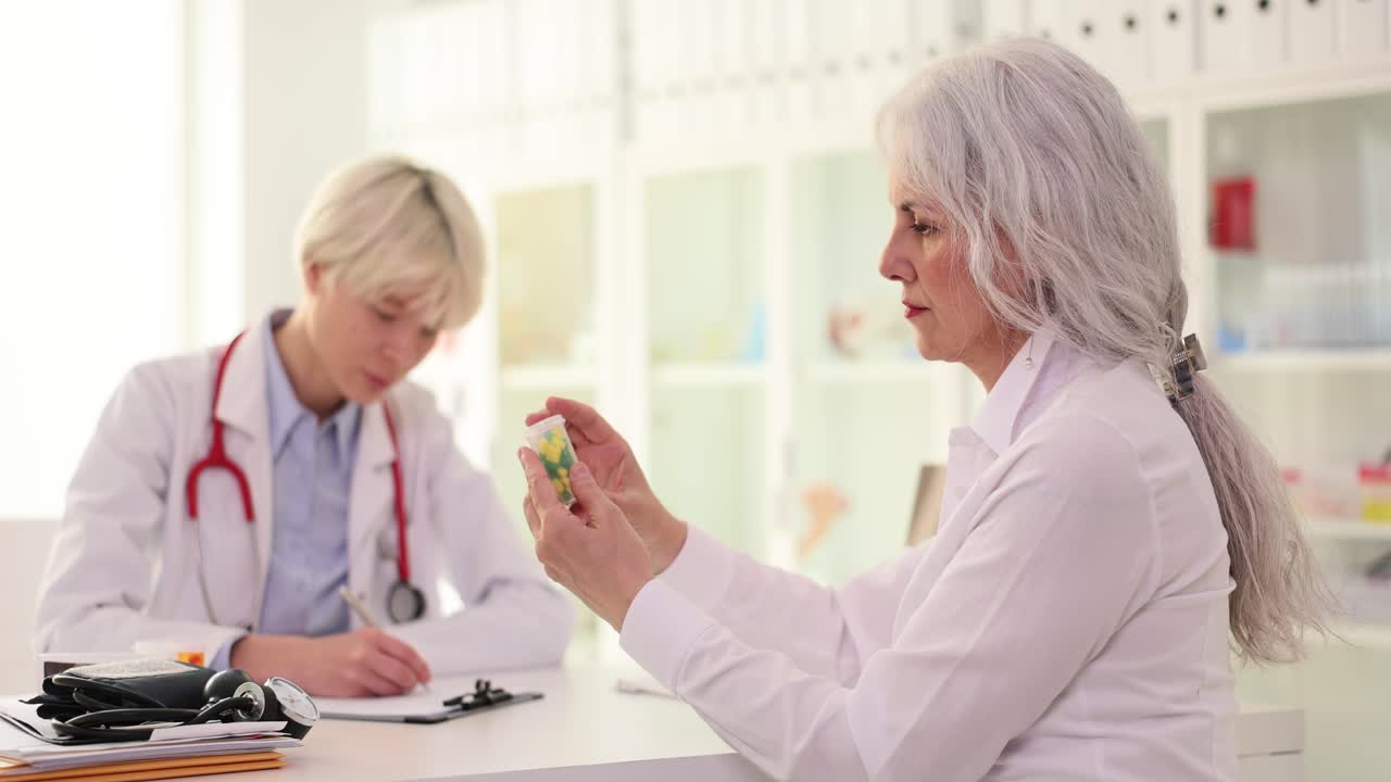 Elderly Woman Consulting Doctor for Medication