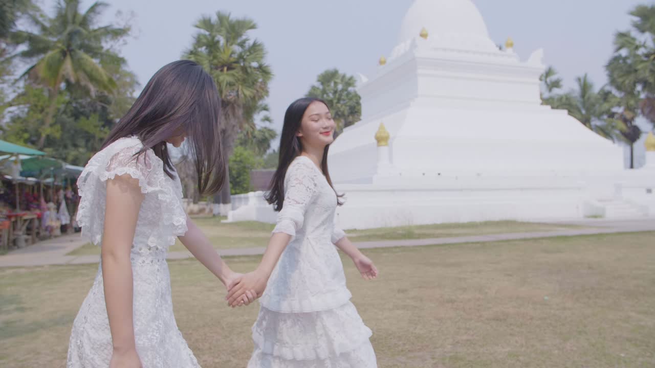 Two Girls Holding Hand And  Having Fun On Summer Travel, Slow Motion