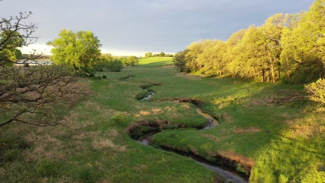 rural landscape with creek and lake