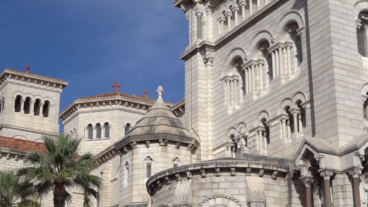 Monaco City, Monaco - July 4, 2025: View of the facade of the Cathedral of Our Lady Immaculate under the blue sky