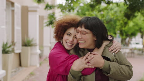 portrait of cute young girl suprise hugging friend girlfriends laughing embracing enjoying togetherness lively urban youth