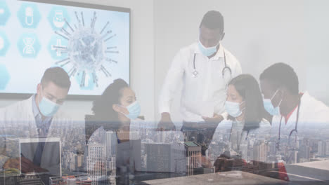 Composite-of-diverse-group-of-male-and-female-doctors-in-face-masks-at-meeting,-and-cityscape