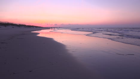 morning sunrise over incoming tide and beach