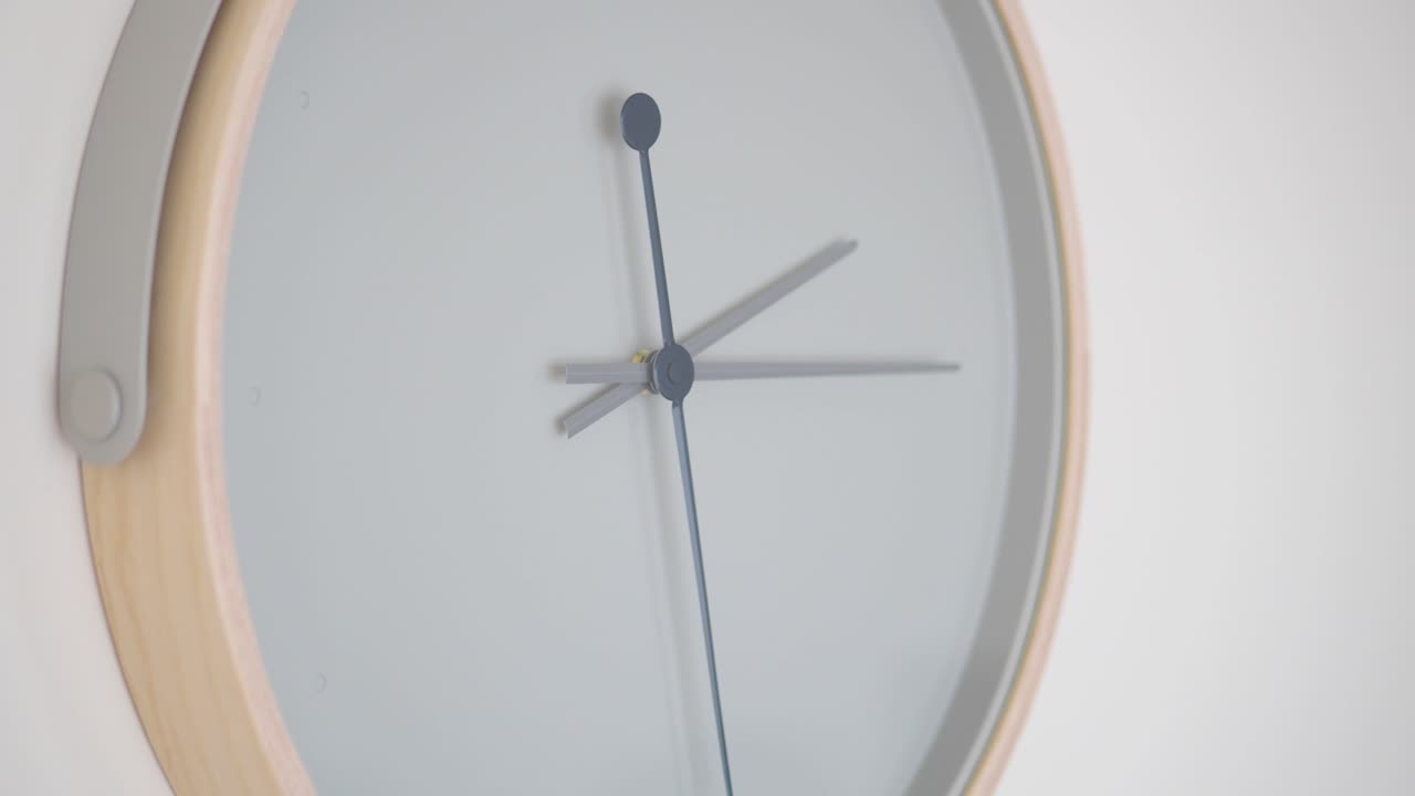 A minimalist wall clock on a white background