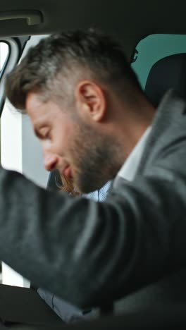 couple in a car dealership