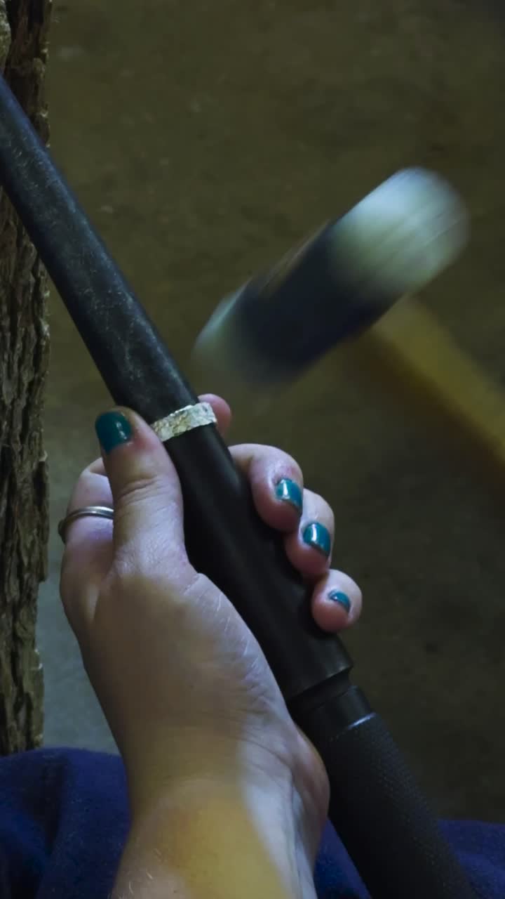 Handmade silver wedding ring crafted in Barcelona, vertical 4K close-up of artisan jewelry work