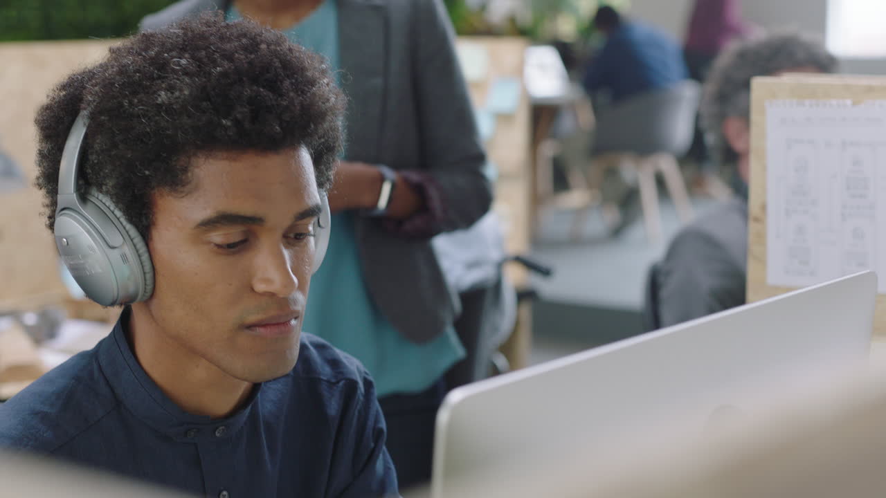 multi ethnic business people brainstorming african american team leader woman sharing ideas pointing at screen showing support teaching colleague discussing project in office workplace