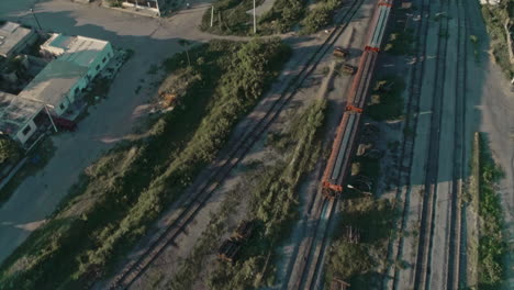 Aerial-Of-A-Freight-Train-Passing-Through-Mexican-northern-Countryside