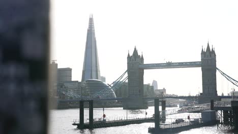 cityscape london tower bridge, the shard, shard skyscraper, cinematic shot panoramic movement, establishment shot during bright day, london city tourist destination