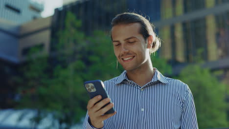 young man using smartphone in an urban setting