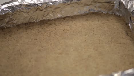 panning shot of the cooked crust for millionaire shortbread cookies