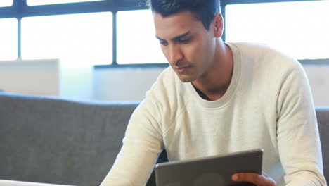 Man-using-tablet-and-laptop