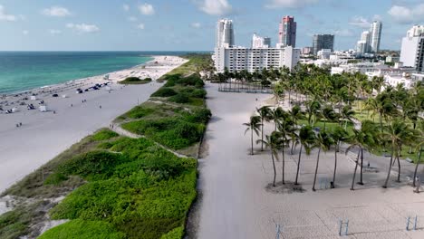 aerial over beach vollyball area along south beach and miami beach florida