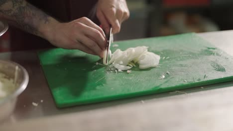 chopping onions on cutting board