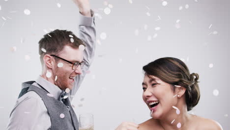 couple celebrating with confetti and champagne