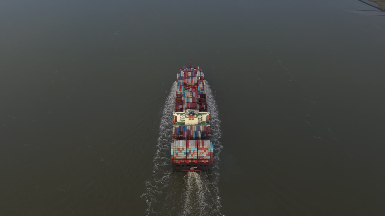 Large cargo ship seen aerially, symbol of global shipping industry