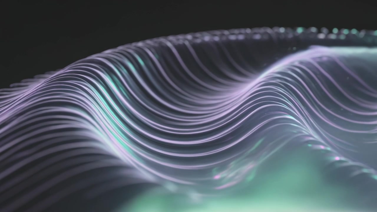 Shifting light strands making waves against black backdrop, teal glow appearing, bead glints moving