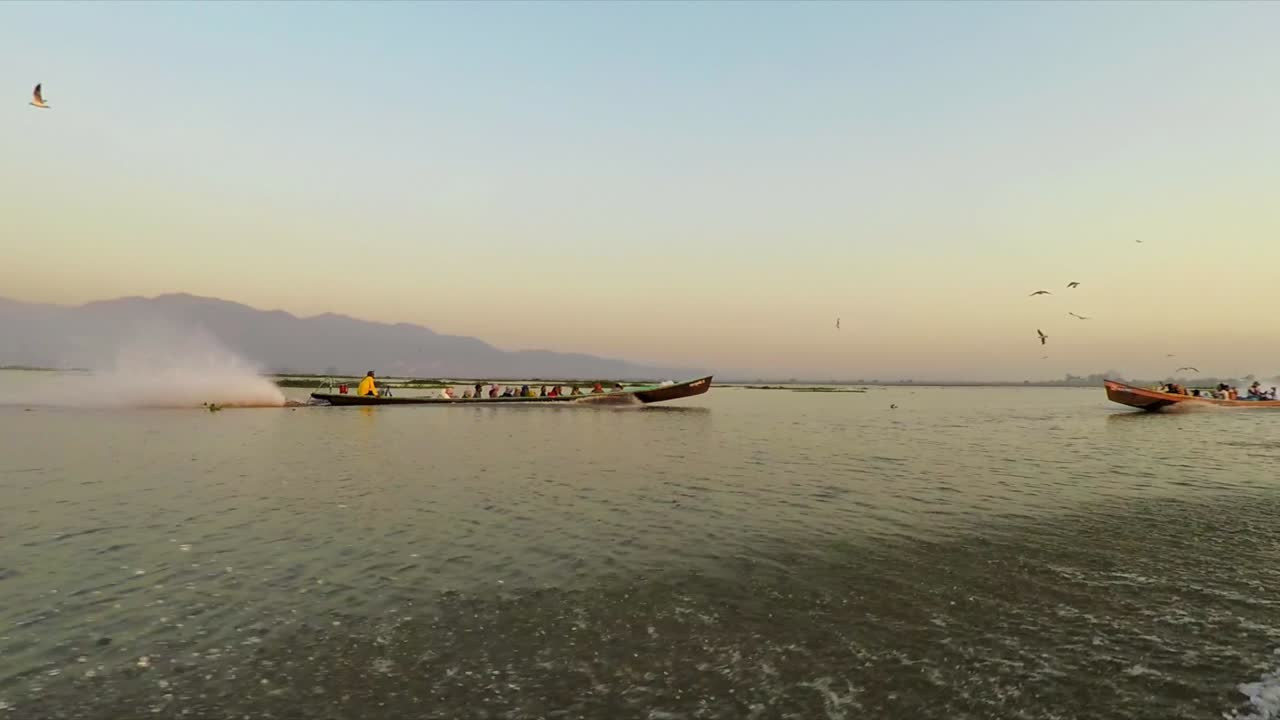 pájaros alimentación lago barco velocidad viaje myanmar inle cámara lenta
