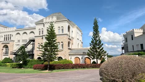 a panoramic view of a grand castle and gardens.