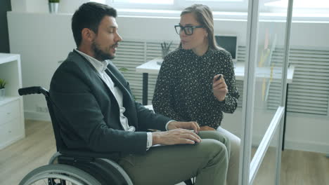 business meeting with person in wheelchair