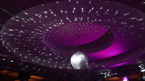 disco ball, view from below, from the disco ball beams, stage light, mirror ball