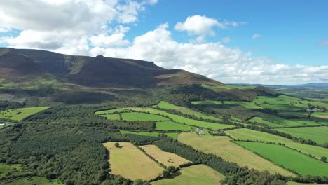 comeragh mountains waterford patchwork of fields in the shadow of the mountains summer evening