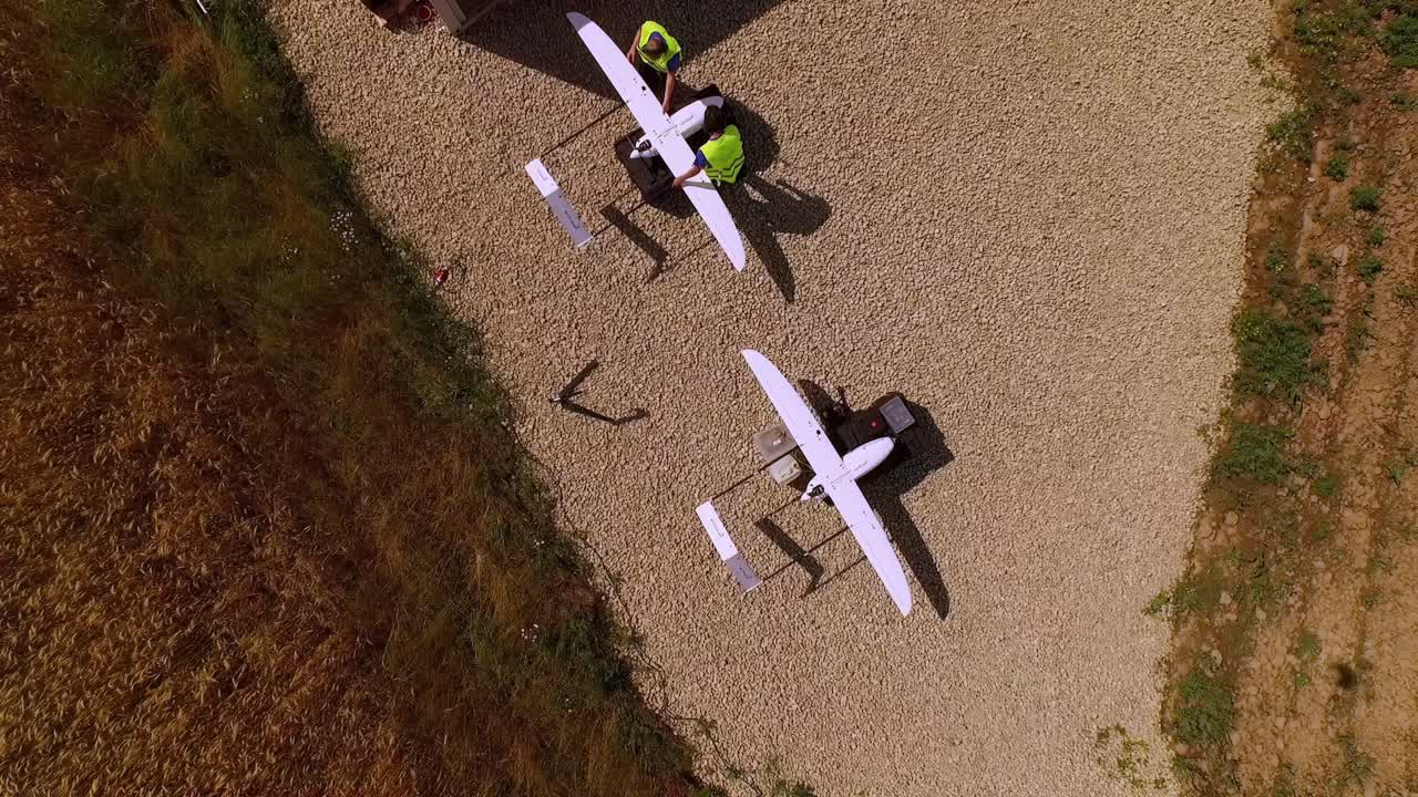 UAVs Ready for Takeoff Bird's-Eye View of Unmanned Aerial Vehicles Prepared for Flight in European Field