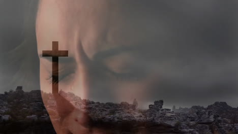 contemplating spirituality, person with somber face in landscape with cross