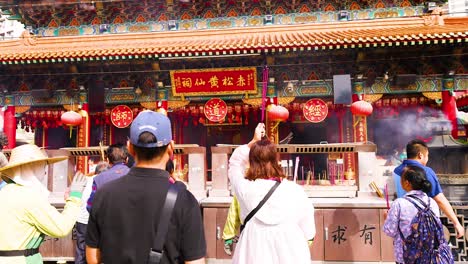 people engaging in rituals at a temple