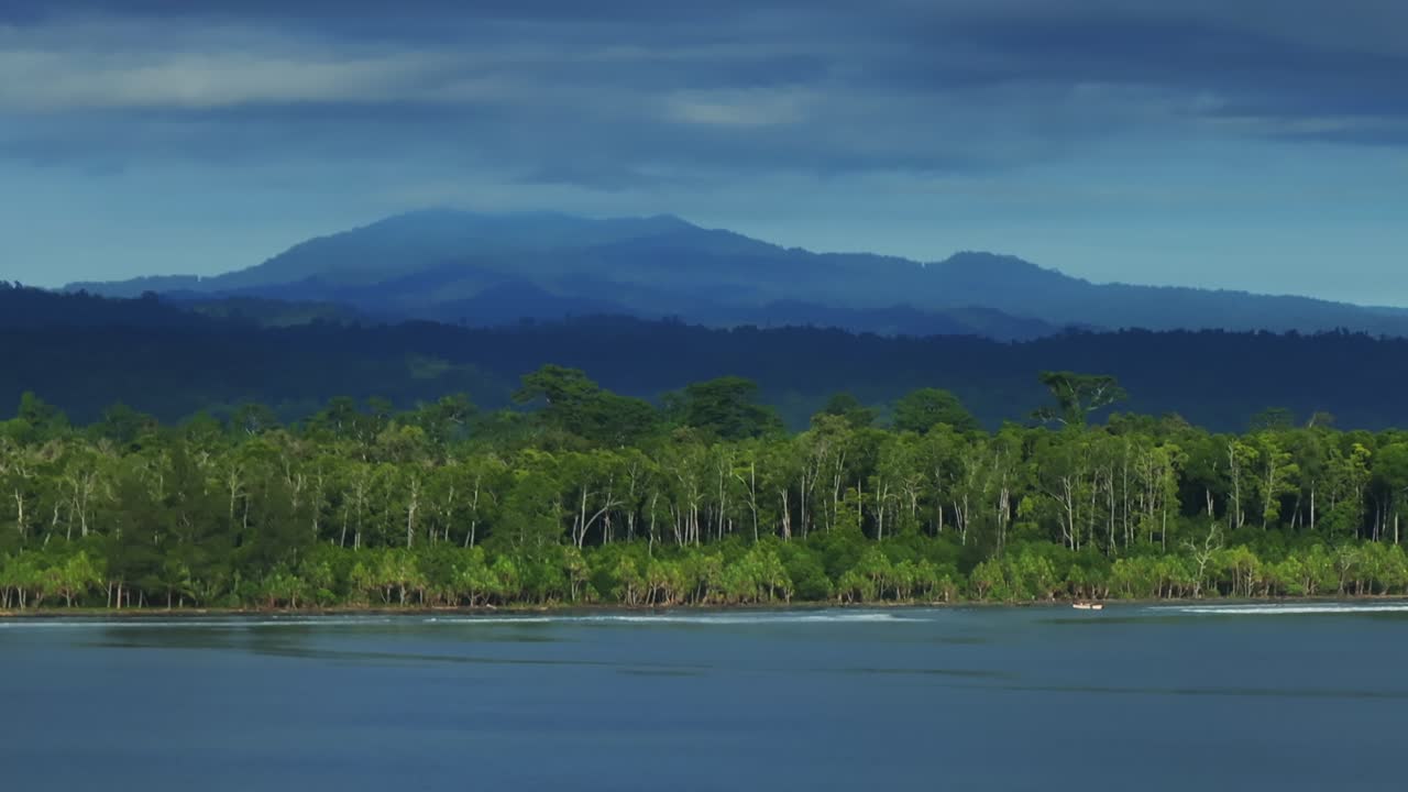 Wewak sea harbour view Wewak Hill Cape Wom Dogreto aerial drone Papua New Guinea Pacific Ocean pristine remote tropical beach coastline sunny dry season blue sky morning mountain pass parallax right