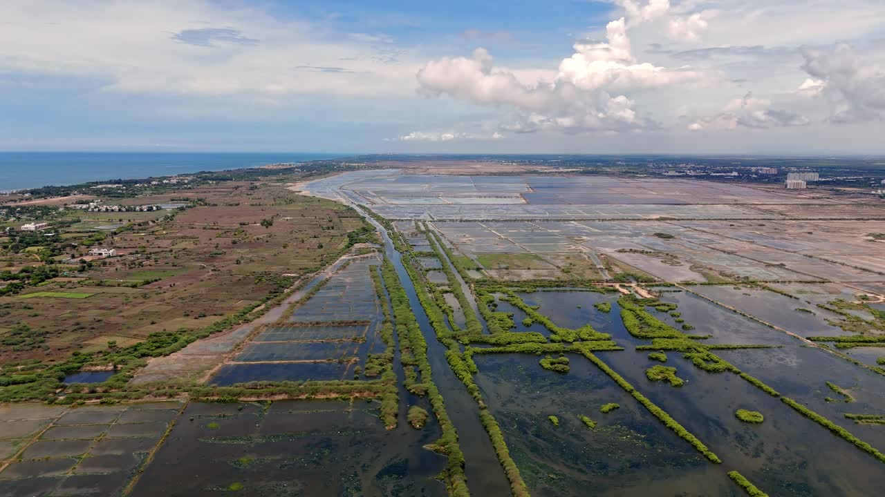 Drone view of agriculture lands rain flooded during daytime.