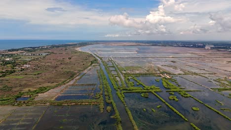 drone view of agriculture lands rain flooded during daytime.