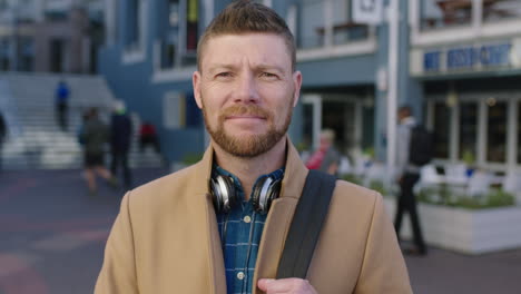 slow motion portrait of charming caucasian man putting on backpack smiling happy in urban background