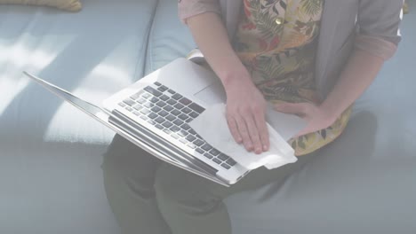 animation of flashing words with woman disinfecting her laptop