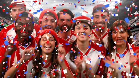 group of fans cheering for their team with confetti