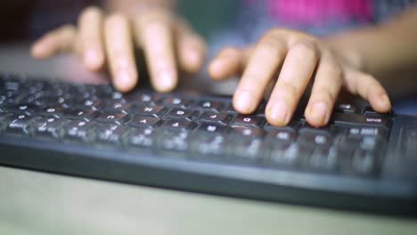 business, education, programming, people and technology concept - close up of asian indonesian female hands typing on keyboard