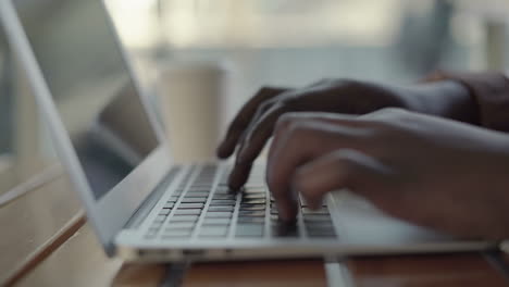 female hands typing on laptop computer