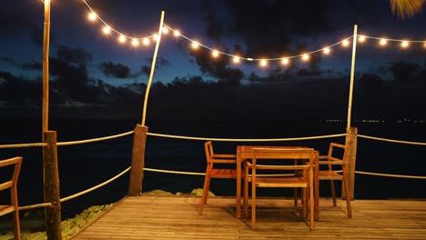 4k time lapse beach restaurant seaside wooden comfortable chair evening sky.