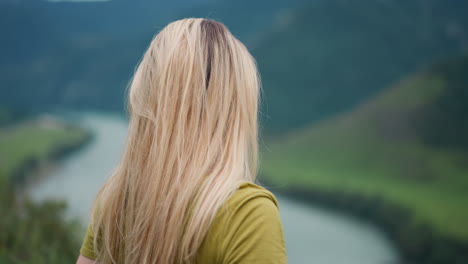 thoughtful woman hiker enjoys mountain valley beauty