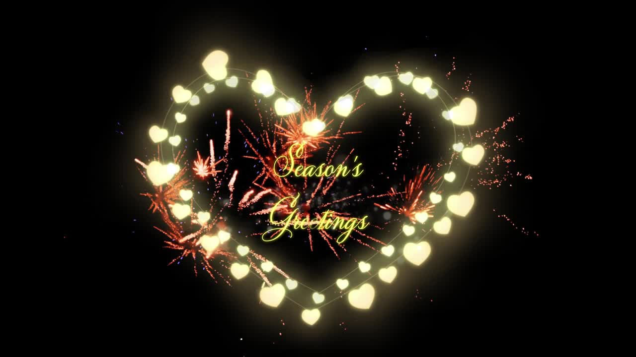 Testo "Auguri di Buone Feste" e lucine a forma di cuore con fuochi d'artificio che esplodono.