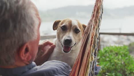 Senior-man-and-his-dog-at-home