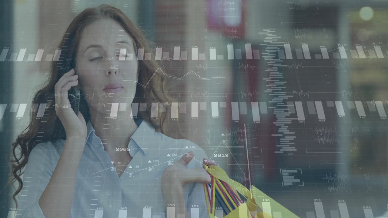 Digital charts intensifying as retail shopper holding shopping bags talking on phone while walking