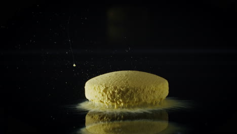 timelapse of amber medicine pill capsule dissolving in water like a decomposing drug capsule in stomach and instestines