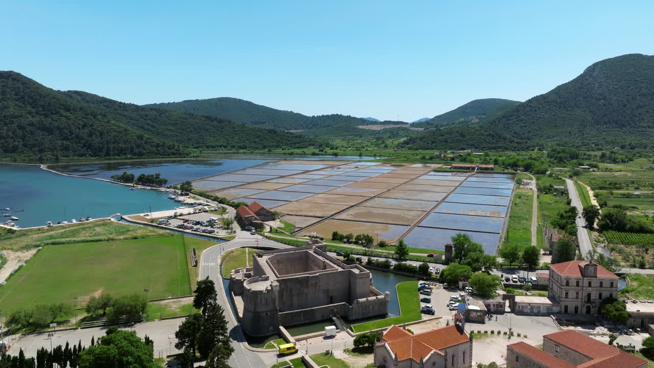 Kastio Fort With Salt Flats And Mountains In The Background In Ston, Croatia. Aerial Drone Shot