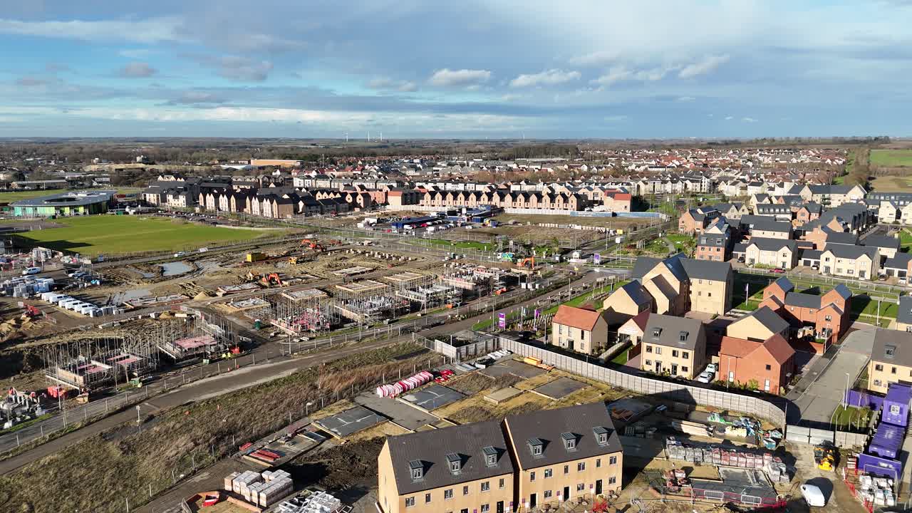 New build houses Wintringham St Neots UK aerial push in